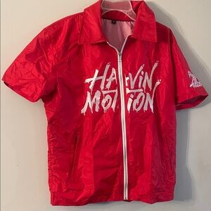 Red Short Sleeve zip up men’s top medium with White graphics text collar